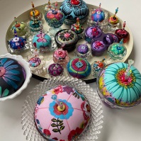 Pincushions in salt cellars and other glass vessels